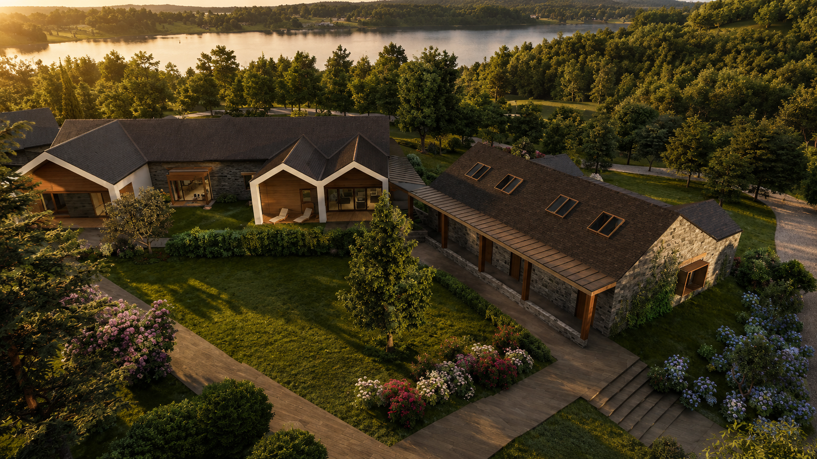 Aerial view of the residence: the living wing and the colonnaded outbuilding enclose an inner courtyard, mature trees behind them and water above the trees